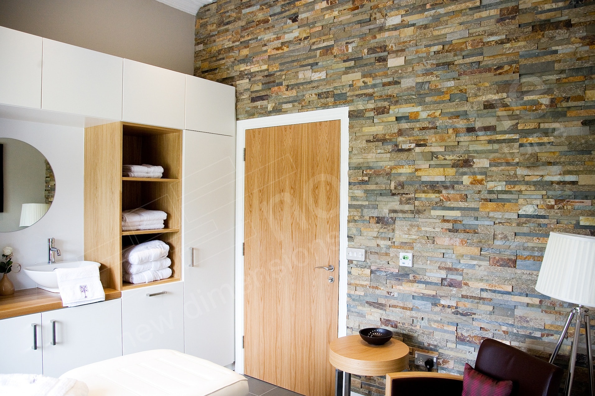 Stacked Stone Accent Wall in the treatment room of a new assisted living facility